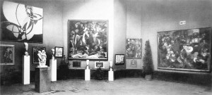 The Salon d'Automne of 1912, held in Paris at the Grand Palais from 1 October to 8 November. Joseph Csaky’s sculpture Groupe de femmes of 1911-12 is exhibited to the left, in front of two sculptures by Amedeo Modigliani. Other works by Section d'Or artists are shown (left to right): František Kupka, Francis Picabia, Jean Metzinger and Henri Le Fauconnier